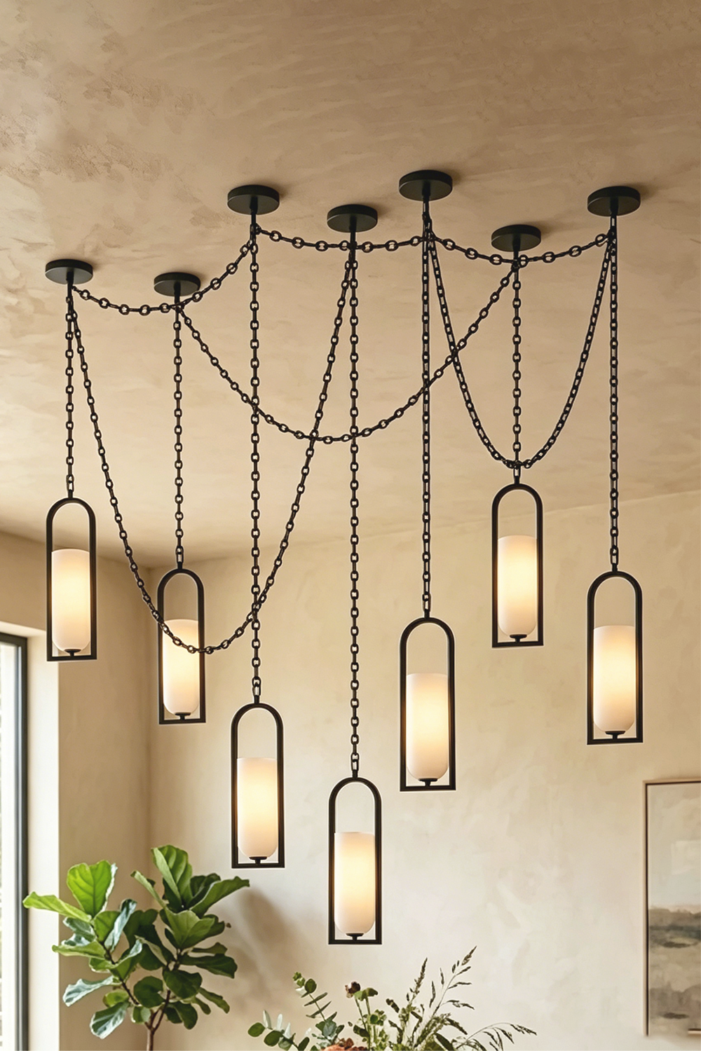 Cressida Alabaster Melange Chain Chandelier hanging from the ceiling in an upscale modern interior.