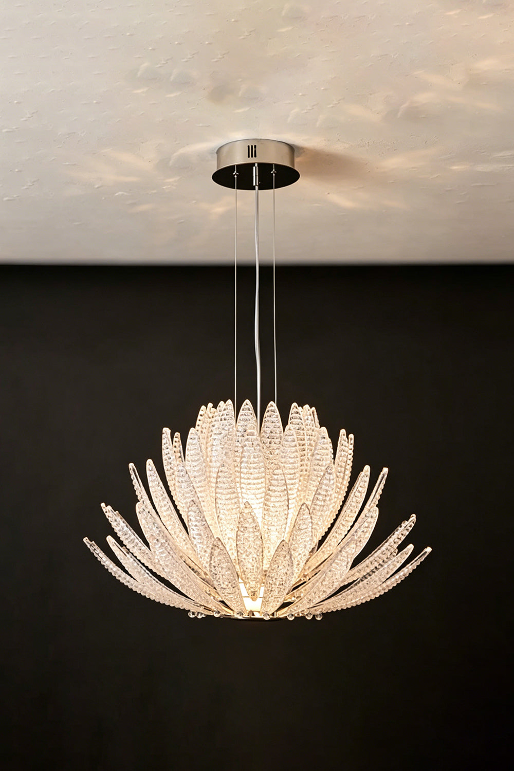Helios Agave Glass Starburst Chandelier | Glass, Metal | Clear glass variant unlit against a black background, showing the frosty glass texture | Isolated shot | vexa lamps