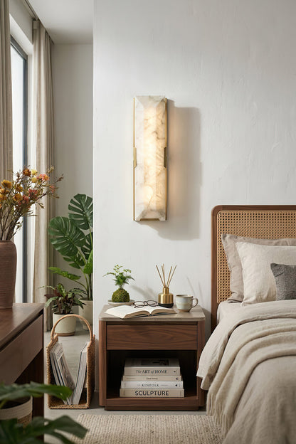 Long rectangular alabaster wall lamp | Brass, Alabaster | Mounted in a cozy bedroom with natural light | vexa lamps