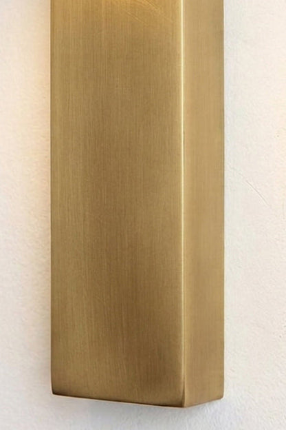 Alaric Alabaster Bar Wall Sconce | Natural Alabaster and Brass | Detailed macro shot focusing on the smooth texture and brushed finish of the golden metal bar | vexa lamps