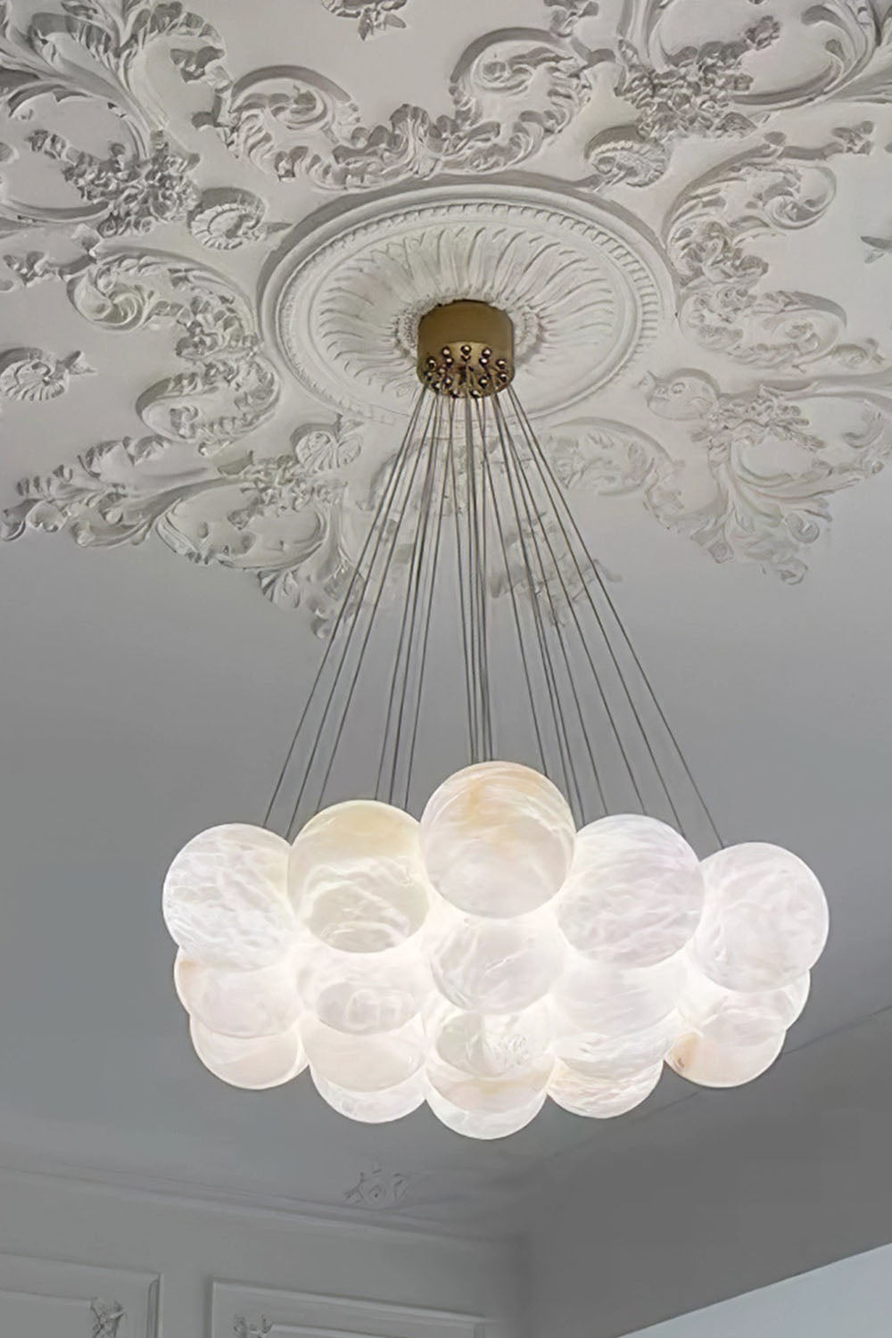 Amandine Alabaster Globe Cluster Pendant Light with elegant rounded alabaster globes hanging from a decorative ceiling rose.