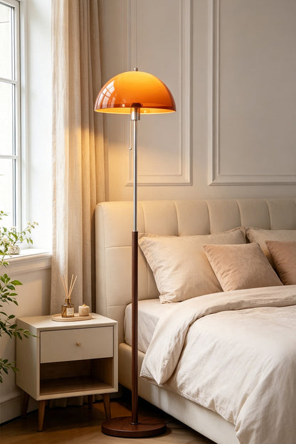 Ambrose Amber Dome Floor Lamp | Amber Glass, Metal and Wood | Standing beside a bed in a cozy bedroom setting | vexa lamps