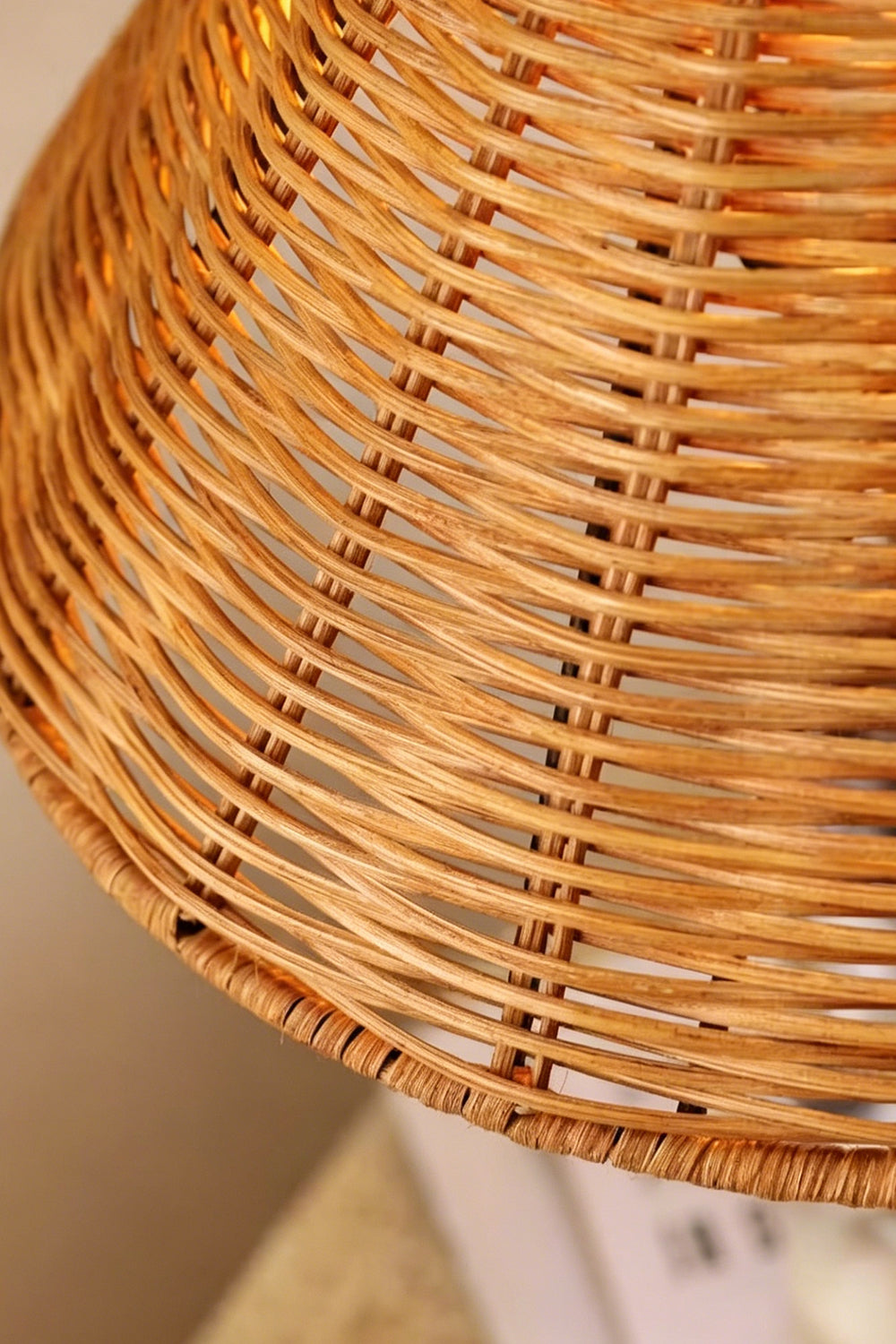 Close-up of the woven rattan shade on the Aria Rattan & Stacked Marble Table Lamp showcasing its intricate texture.