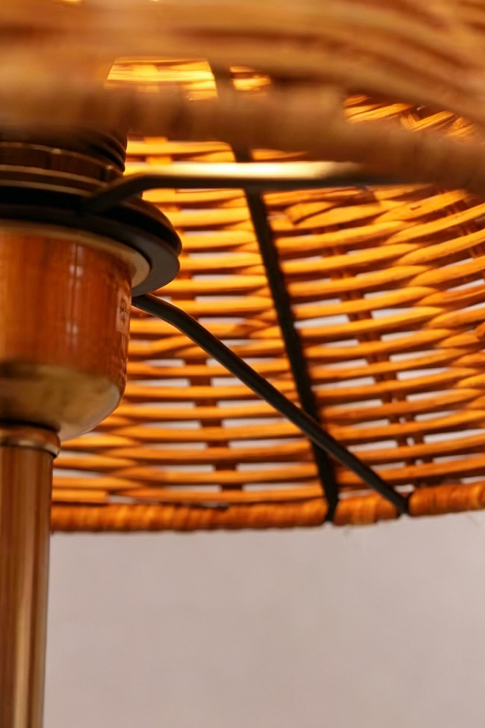 Close-up of the Aria Rattan & Stacked Marble Table Lamp showcasing its woven rattan shade and lamp details.