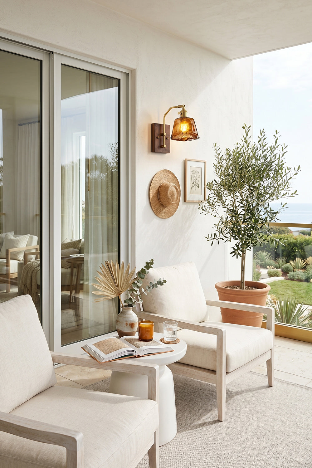 Arlo Amber Ripple Wall Lamp | Glass, Metal, Wood | Mounted on a white wall as exterior accent lighting on a contemporary balcony with white lounge chairs next to sliding glass doors | vexa lamps