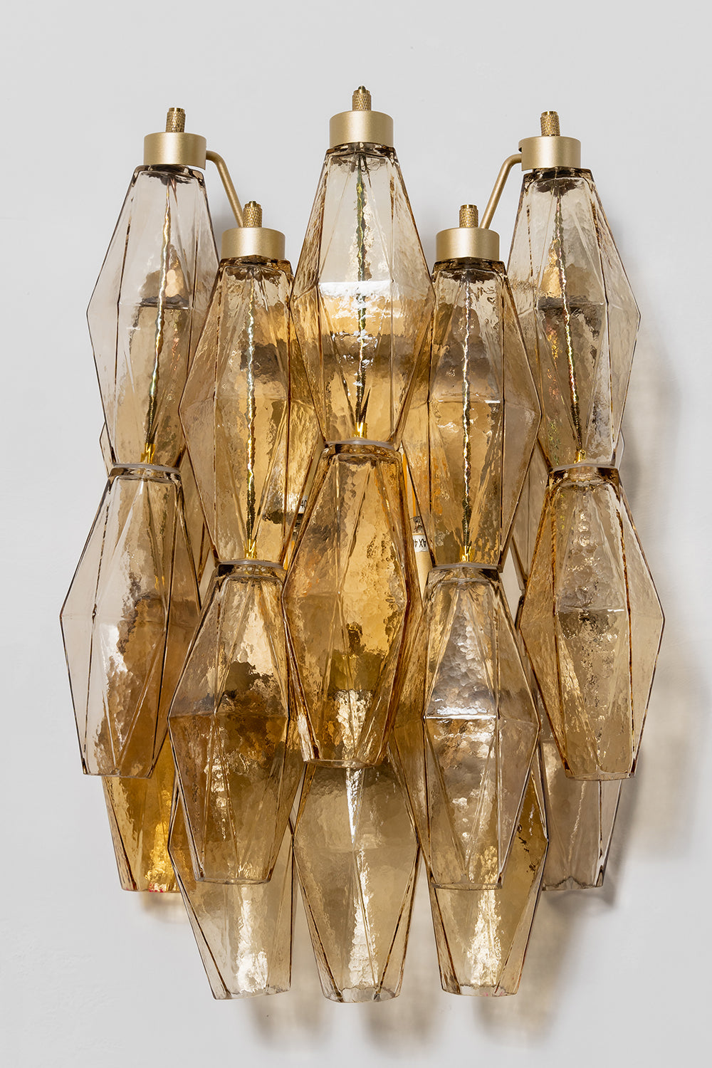Unlit amber Art Poliedri wall sconce | Metal, Glass | Front perspective showing the layered glass prisms | vexa lamps