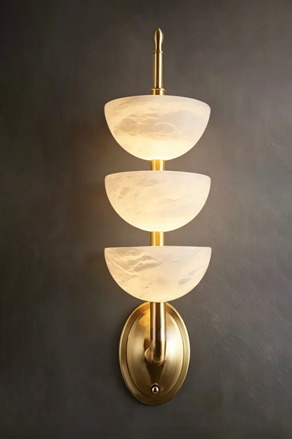 Ascendant Wall Lamp on dark wall | Alabaster, Brass | High contrast lit view against charcoal background | vexa lamps