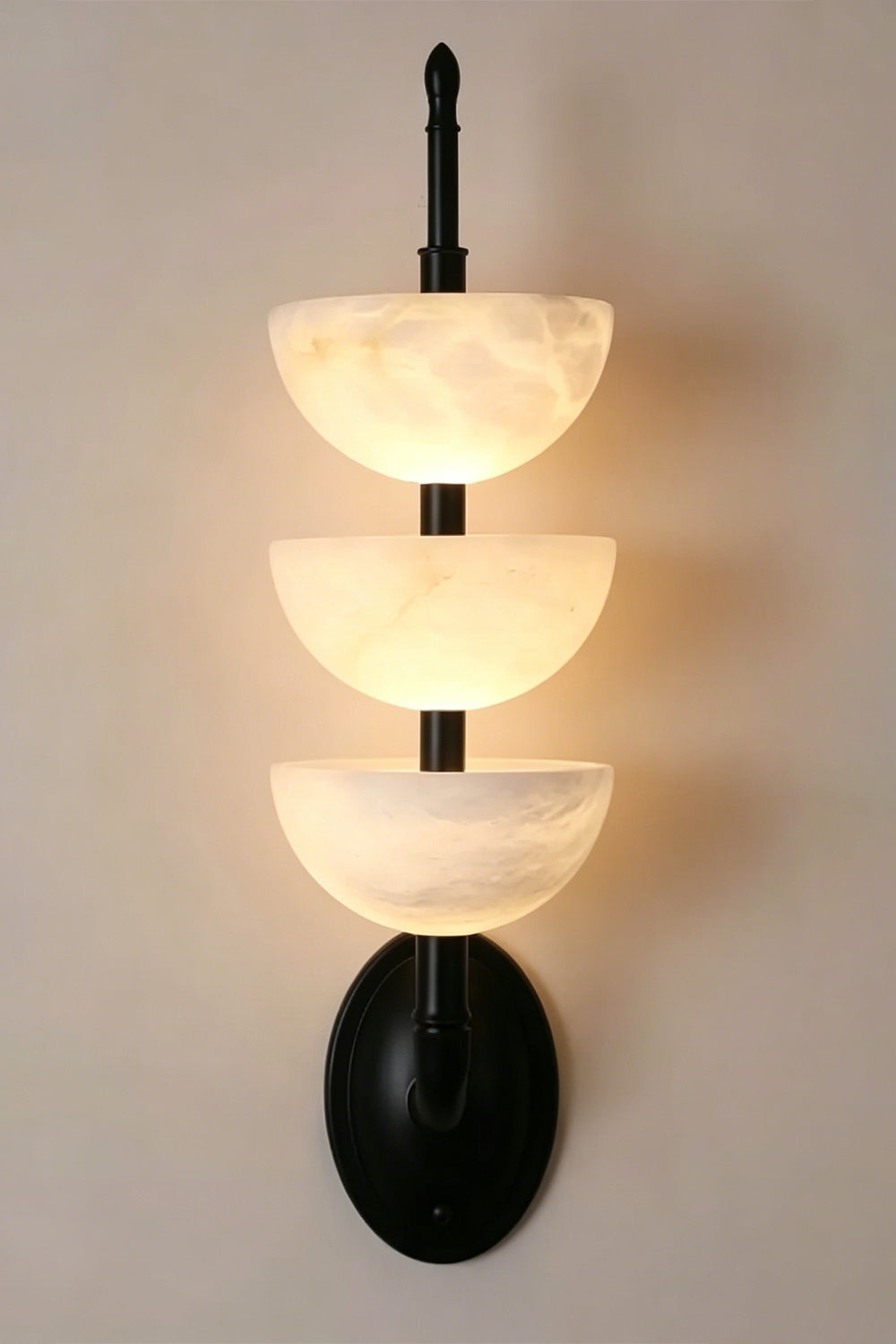 Ascendant Wall Lamp with black finish | Alabaster, Metal | Lit view with matte black mounting hardware | vexa lamps
