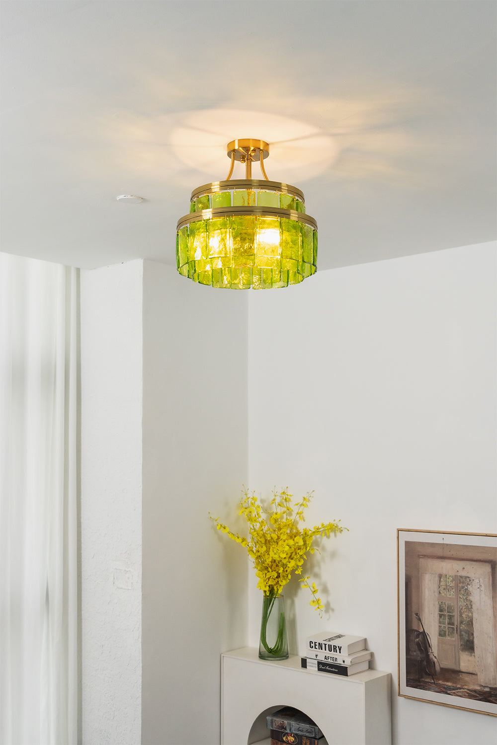 Aura Verdant Tiered Green Glass Ceiling Light | Metal, Glass | Mounted on the ceiling of a minimalist room corner above a white sideboard with yellow flowers | vexa lamps