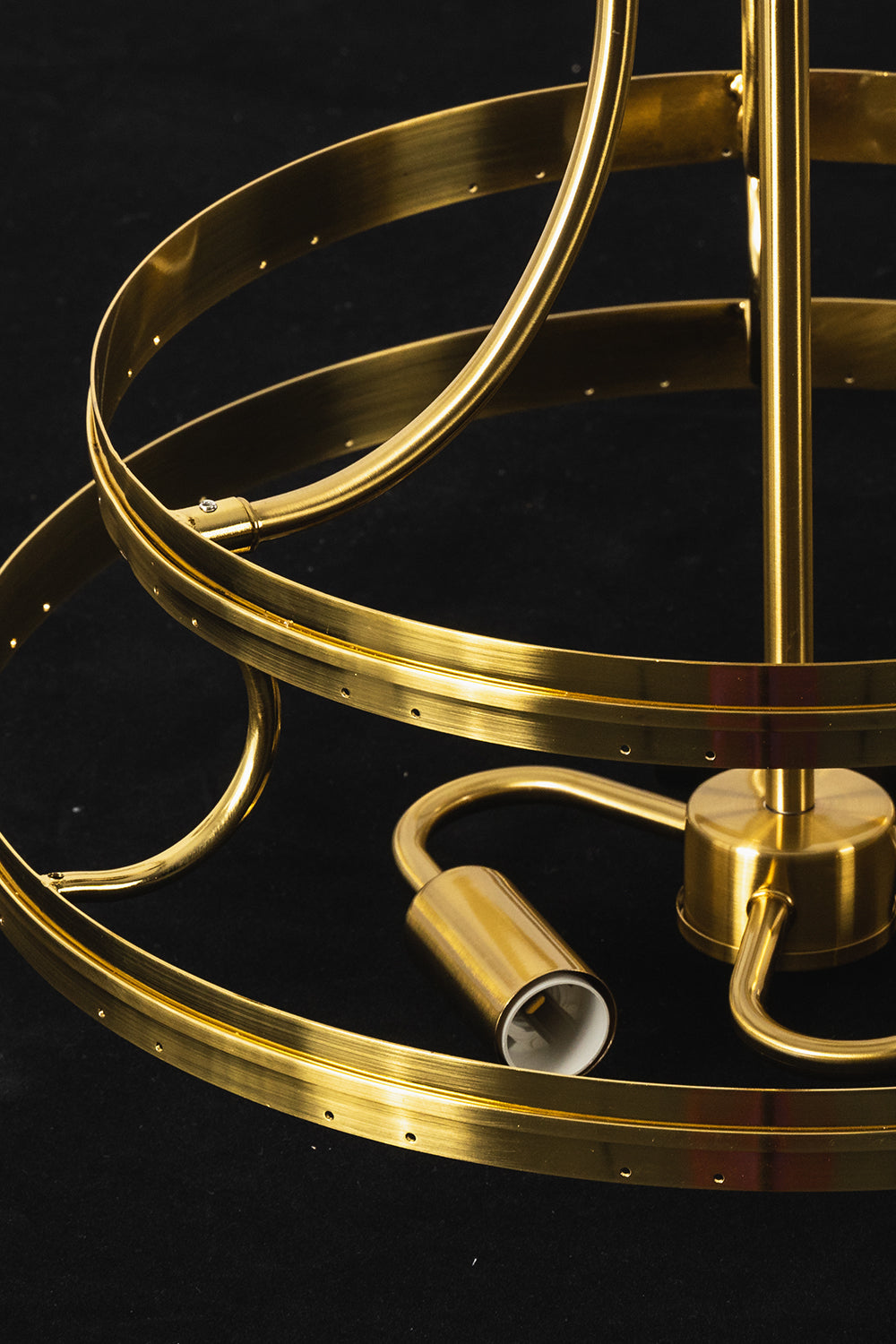 Aura Verdant Tiered Green Glass Ceiling Light | Metal, Glass | Detailed view of the unlit gold frame ring and internal bulb sockets against a dark background | Detail shot | vexa lamps