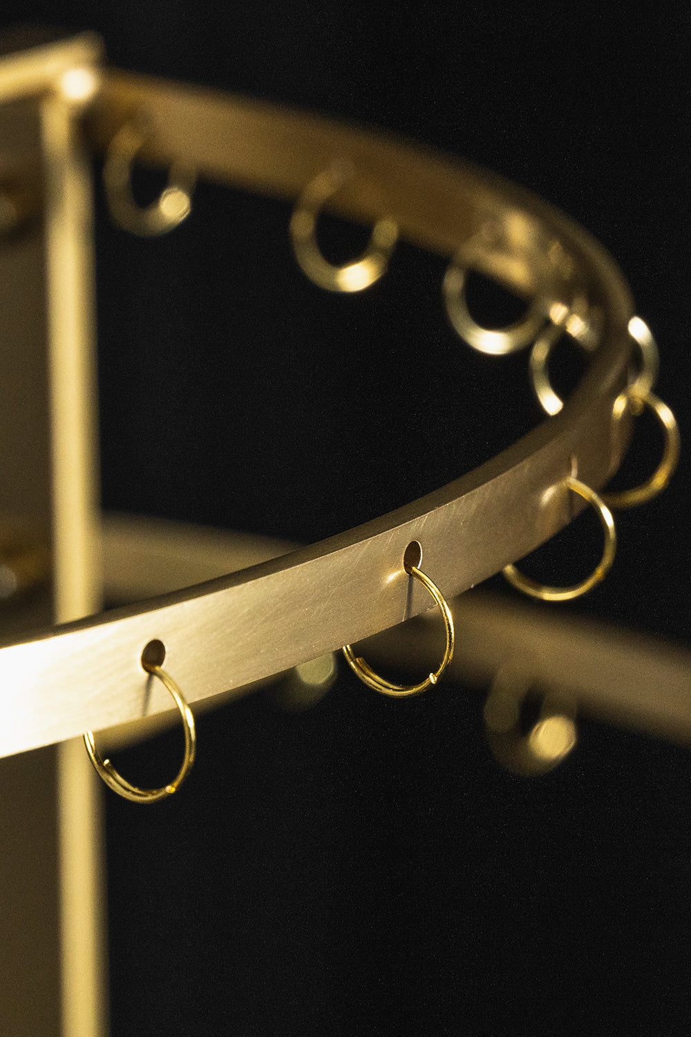 Aurelia Tiered Capiz Table Lamp | Capiz Shell, Metal | Close-up focus on the empty tiered gold brass metal frame showcasing the small hanging ring attachments | Detail shot | vexa lamps