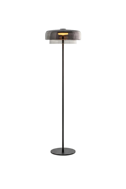 Aven Minimalist Architectural Floor Lamp | Glass, Metal | Isolated product shot of a contemporary architectural floor lamp featuring a slender matte black pole and a smoky grey glass cylinder shade | White background | vexa lamps