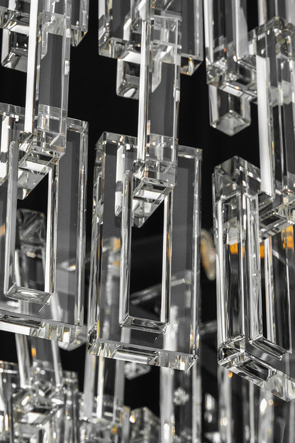 Aven Tiered Glass Prism Chandelier | Glass, Metal | Extreme close-up highlighting the interlocking rectangular clear glass link prisms hooked onto the frame | Detail shot | vexa lamps