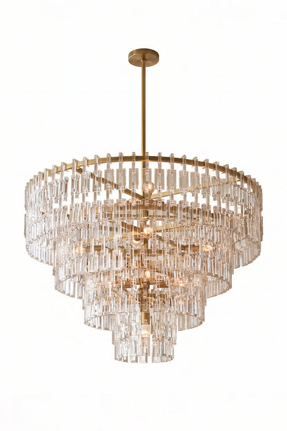 Aven Tiered Glass Prism Chandelier | Glass, Metal | Isolated lit product shot of the multi-tiered gold frame crystal variant radiating a warm golden glow on a white background | vexa lamps