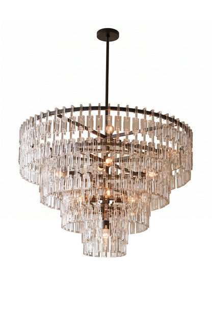 Aven Tiered Glass Prism Chandelier | Glass, Metal | Isolated lit product shot of the multi-tiered black frame crystal variant glowing intensely on a white background | vexa lamps