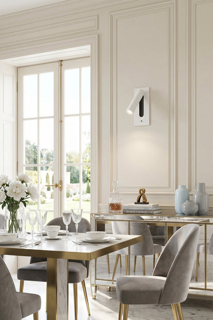 Axial Pivot Folding LED Wall Lamp elegantly enhancing a minimalist dining area with sleek decor and natural light.
