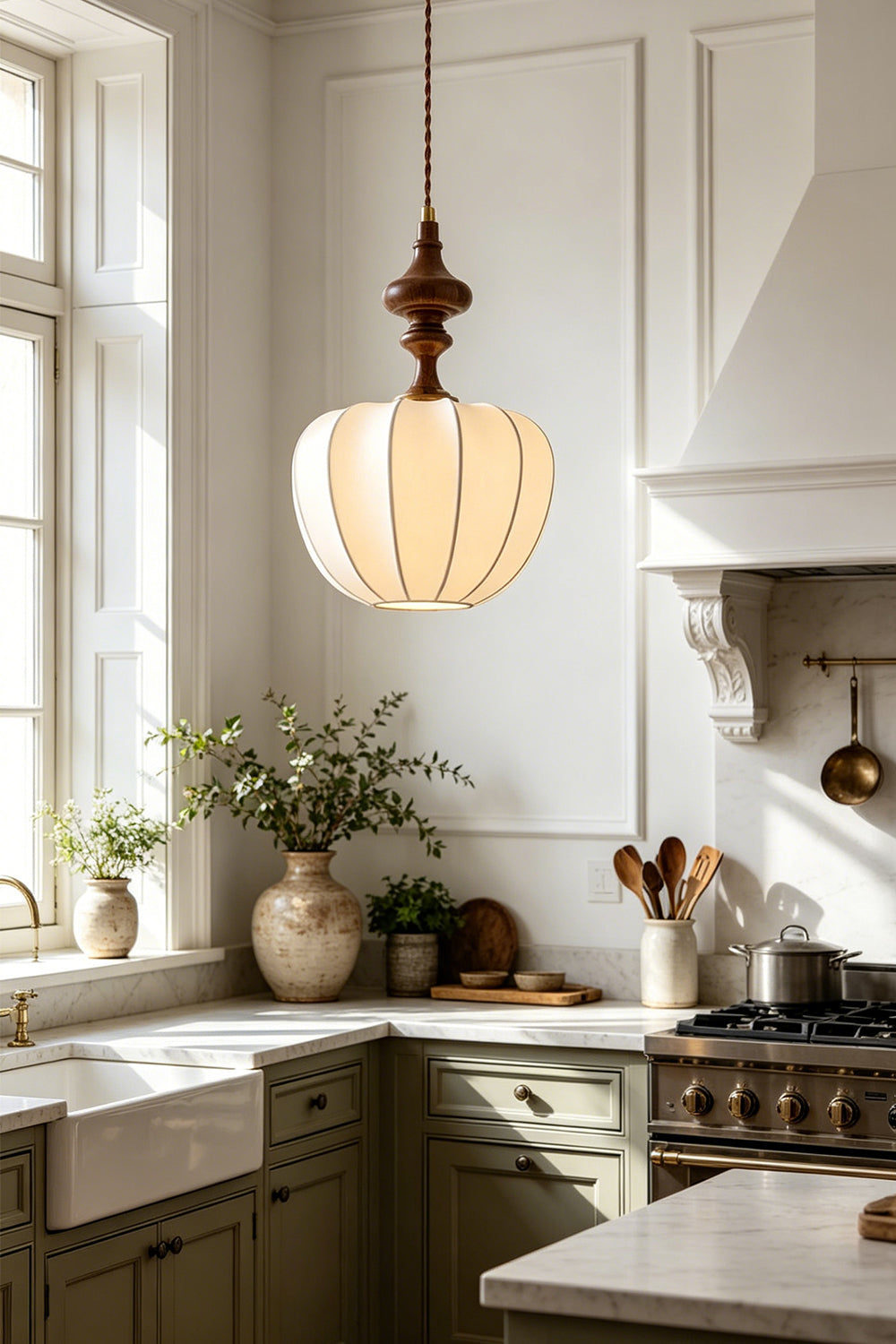 Baird Mid-Century Silk Pendant Light hanging elegantly in a kitchen with natural light and decor.