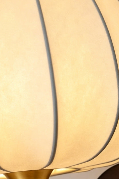 Baird Mid Century Pumpkin Wall Lamp | Metal, Fabric, Wood | Macro focus on the translucent ribbed fabric lampshade with a warm inner glow | Detail shot | vexa lamps