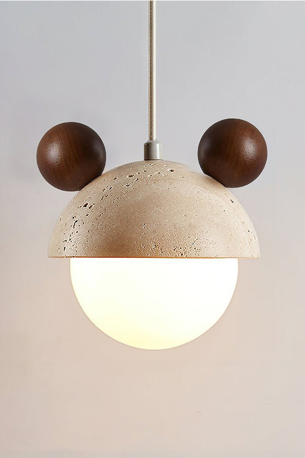 Lit bear ear travertine pendant with dark accents | Travertine, Metal, Glass | Close-up front view showing warm glow | vexa lamps