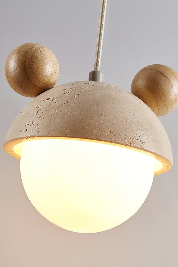 Side perspective of lit bear ear stone pendant | Travertine, Metal, Glass | Showing the warm illumination and textures | vexa lamps