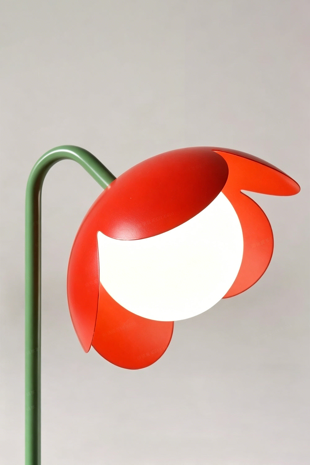 Floor lamp head detail | Metal, Glass | Close-up of red metal petals and glass globe | Artistic botanical design | vexa lamps