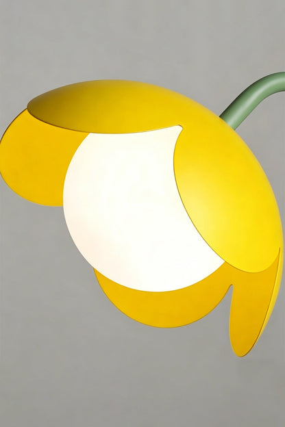 Floor lamp head detail | Metal, Glass | Close-up of yellow metal petals and glass globe | Vibrant flower aesthetic | vexa lamps
