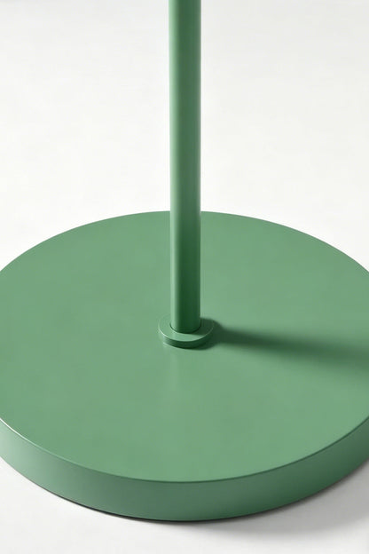 Floor lamp base detail | Metal | Close-up of circular green metal base and stem | Matte finish texture | vexa lamps