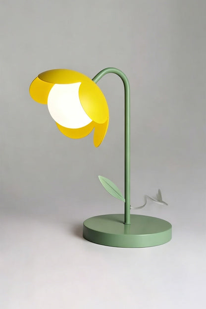 Isolated red botanical table lamp | Metal and glass | Stylized tulip shape with green base, red petals, white globe | Light grey background | Front angular view | vexa lamps