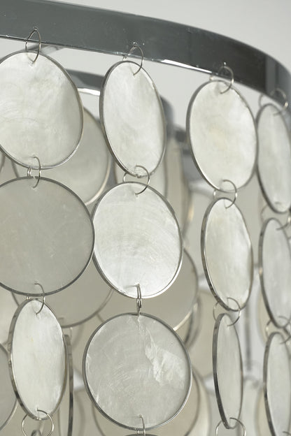 Cascading shell discs on metal frame | Iron | Shell | Side profile showing the texture and layering of the chandelier | vexa lamps