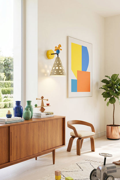 Carousel Horizon Ceramic Wall Sconce | Metal, Resin, Ceramics | Mounted above a modern wooden sideboard next to vibrant geometric abstract art and a curved wooden chair | vexa lamps