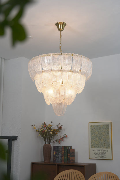 Warm glow glass petal pendant light | Metal, Glass | Installed in a living room corner over a wooden cabinet | vexa lamps