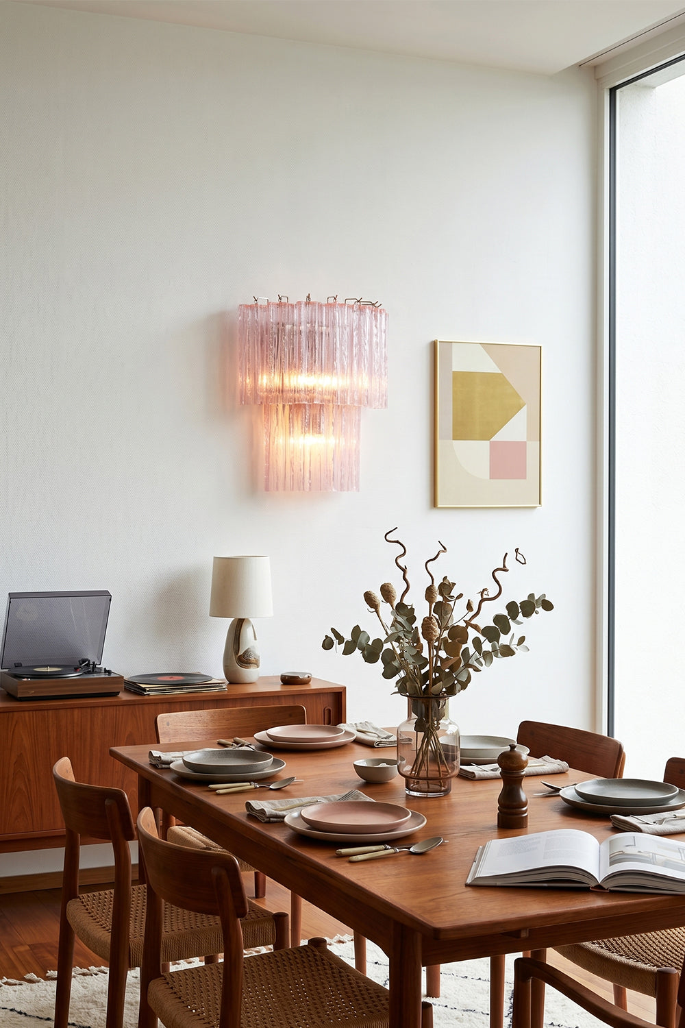 Cascading Prism Pink Glass Wall Light | Glass, Metal | Decorative wall lighting in a modern dining area with a large wooden table | vexa lamps Cascading Prism