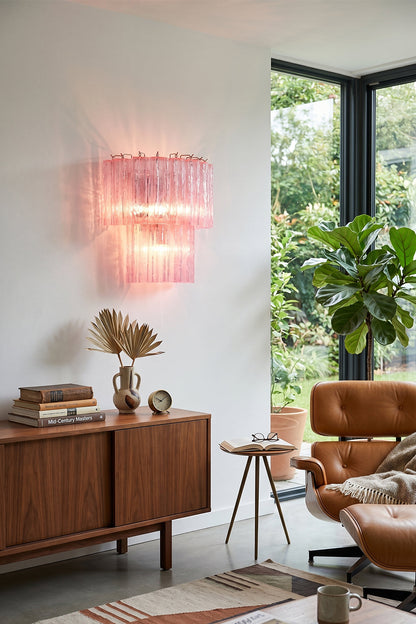 Cascading Prism Pink Glass Wall Light | Glass, Metal | Mounted above a mid-century wooden sideboard in a bright living room | vexa lamps Cascading Prism