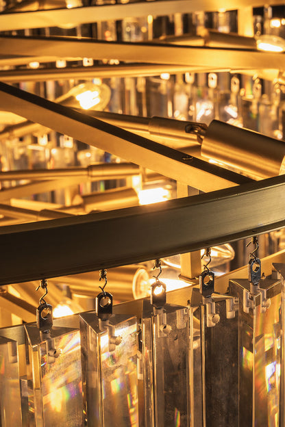 Cassian Tiered Prism Ring Chandelier | Clear Prism Glass and Brass | Detail shot looking through the tiers highlighting inner warm bulbs | vexa lamps