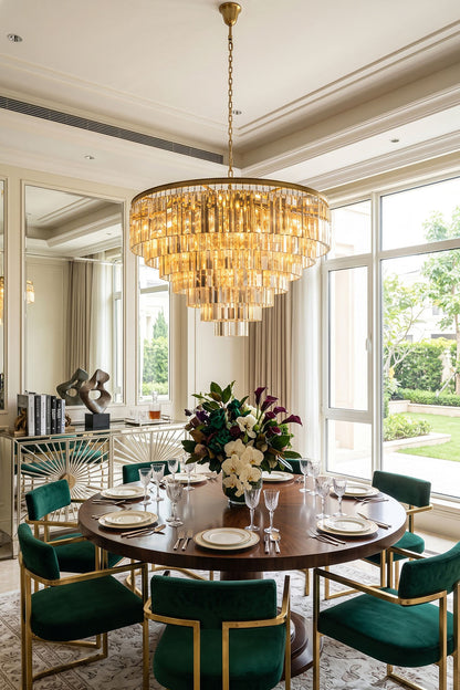 Cassian Tiered Prism Ring Chandelier | Clear Prism Glass and Brass | Centered above a round dining table with green velvet chairs | vexa lamps