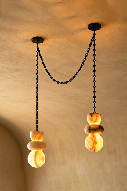 Celestial Alabaster Chandelier | Alabaster, Metal | Two-light swag arrangement on textured wall | vexa lamps