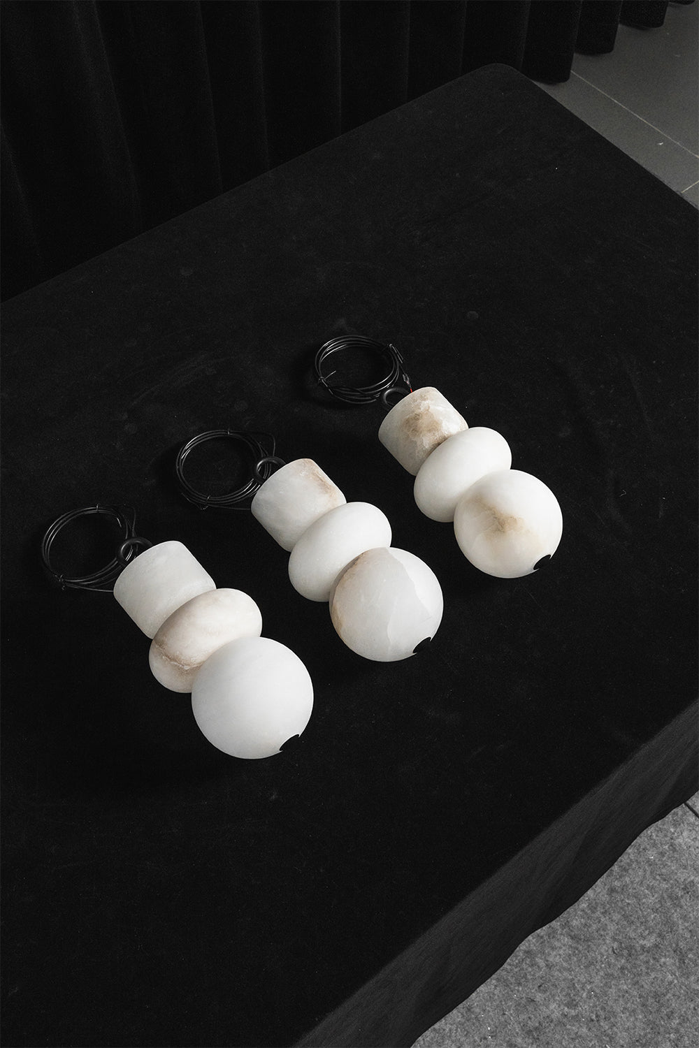 Celestial Alabaster pendants | Alabaster, Metal | Trio of unlit stone shades on dark surface | vexa lamps