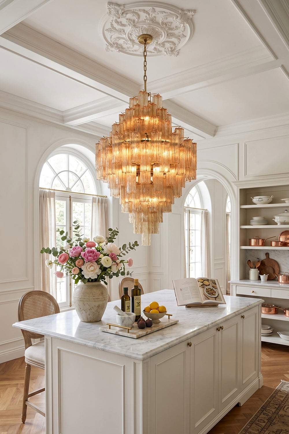 Celestial Glass Cascade Chandelier glowing elegantly above a kitchen island with flowers and decor around.