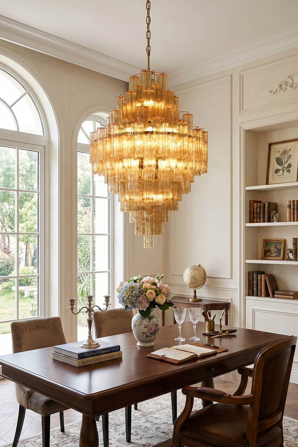 Celestial Glass Cascade Chandelier illuminating an elegant dining room with a beautiful table setup.