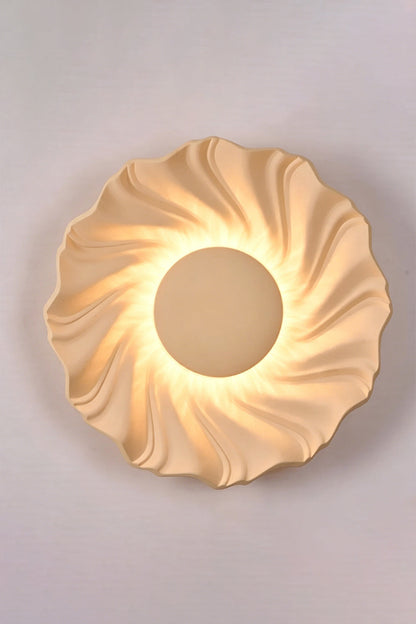 Centripetal Solstice Metal Wall Lamp | Metal, Resin | Creamy coffee textured lamp on a plain background, providing soft light | Isolated lit variant shot | vexa lamps