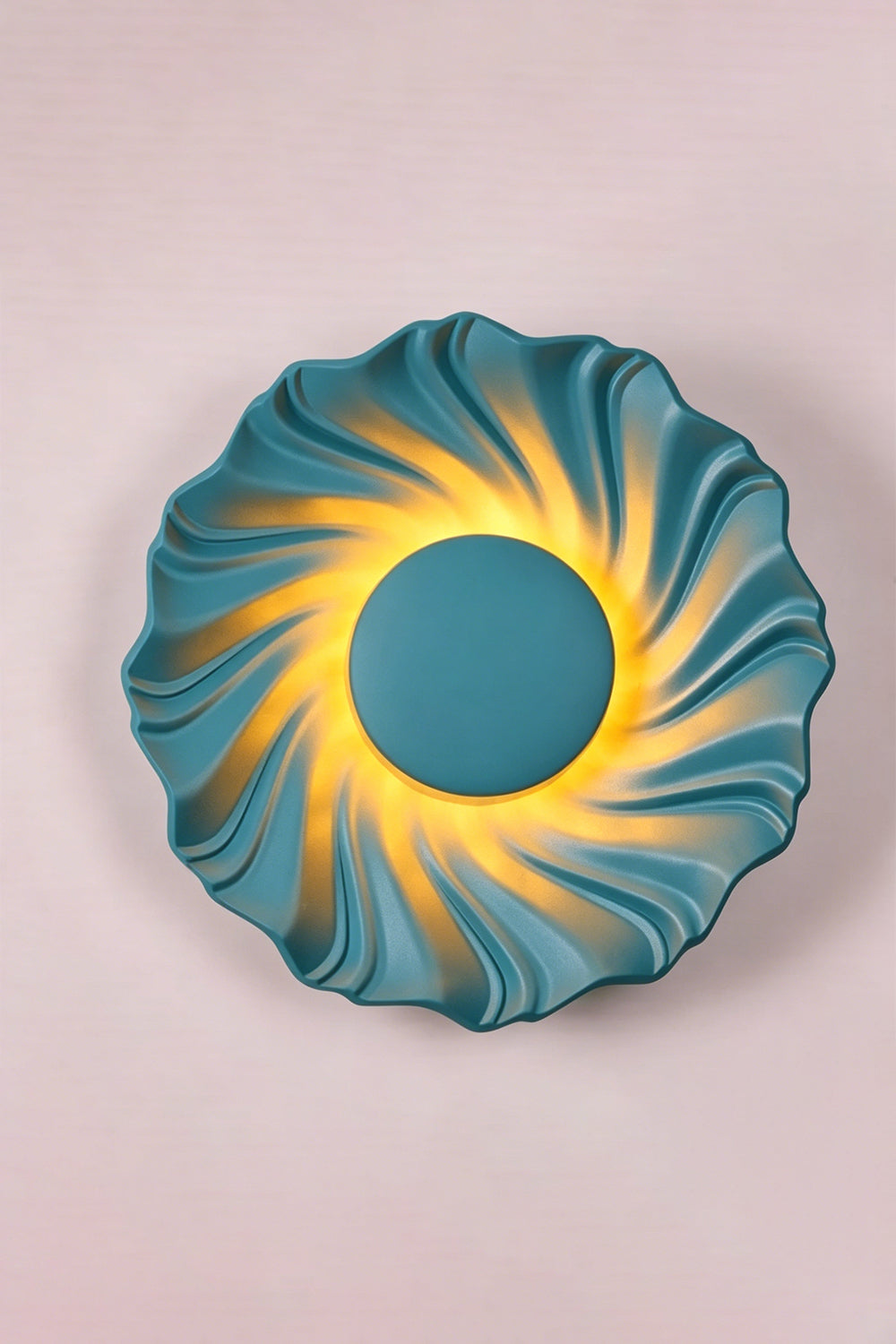 Centripetal Solstice Metal Wall Lamp | Metal, Resin | Blue textured lamp on a plain background, providing warm light | Isolated lit variant shot | vexa lamps