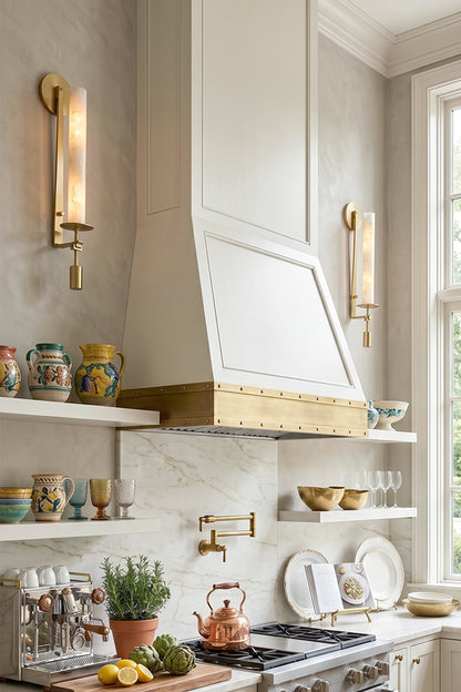 Chantal Twin Alabaster Wall Sconce | Alabaster, Brass | Flanking a pristine white range hood with brass metal trim in a contemporary classical kitchen layout with open shelving | vexa lamps