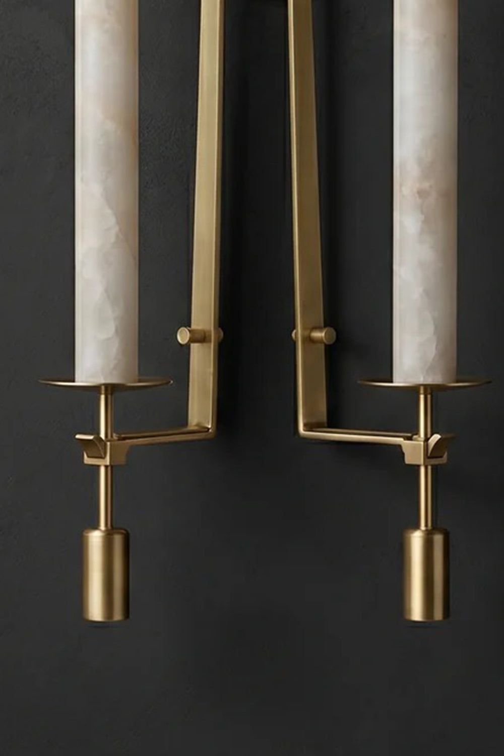 Chantal Twin Alabaster Wall Sconce | Alabaster, Brass | Detailed unlit studio shot of the twin-light brass variant highlighting the symmetrical candle arms and natural stone textures against a charcoal wall | Detail shot | vexa lamps