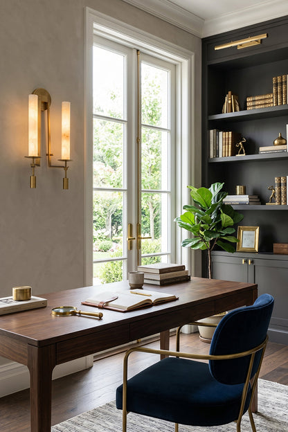 Chantal Twin Alabaster Wall Sconce | Alabaster, Brass | Providing sophisticated accent lighting in a home library office next to a dark wood executive desk and a plush navy blue chair | vexa lamps