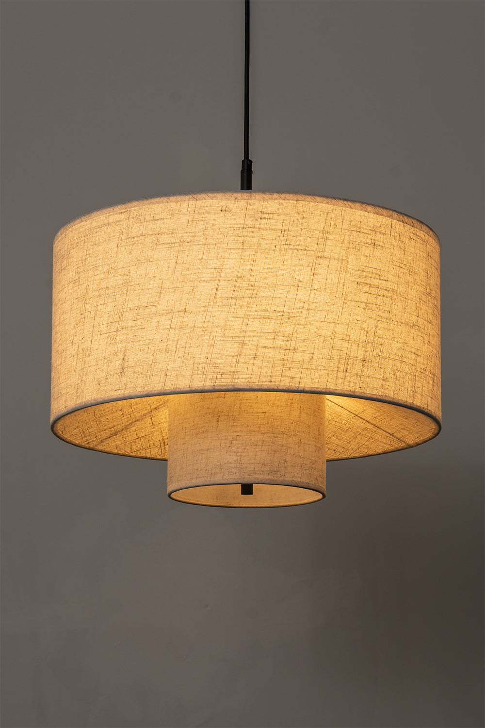 Concentric Veil Fabric Pendant Light | Fabric | Side-view lit product shot against a neutral grey background | vexa lamps