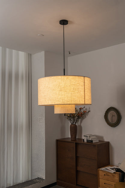 Concentric Veil Fabric Pendant Light | Fabric | Positioned next to a dark wood dresser in a clean interior | vexa lamps