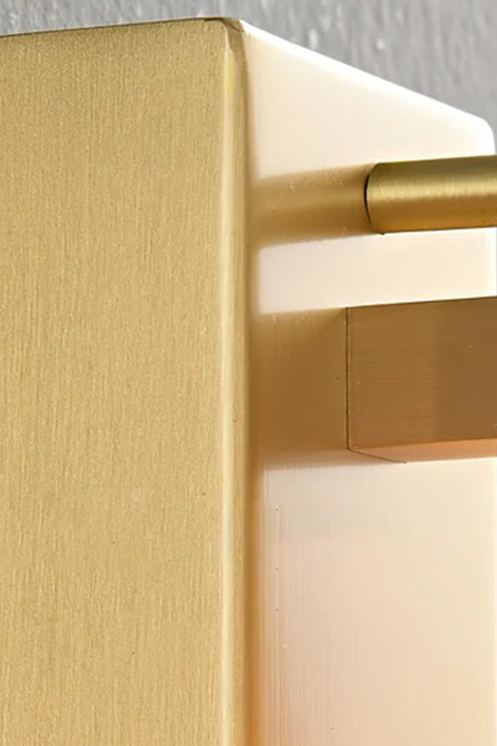 Close-up view of the Corin Alabaster Wall Sconce showing its brass-finished metal and alabaster details.