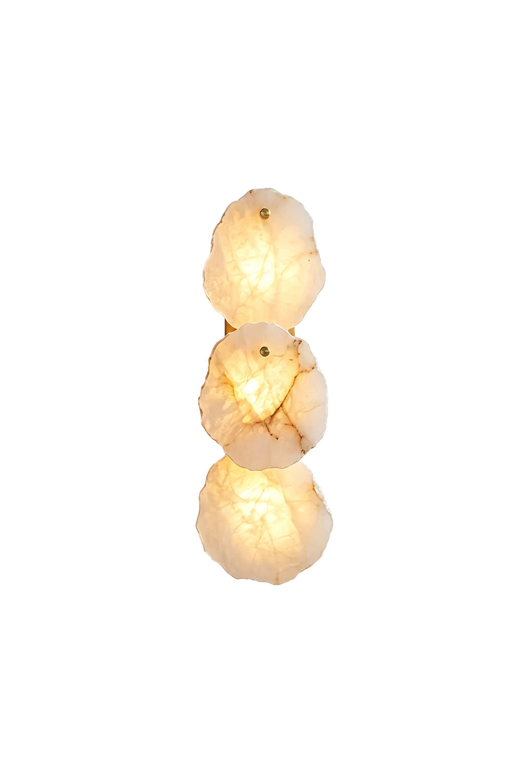 Corin Alabaster Wall Sconce with three illuminated alabaster shades providing a warm glow.