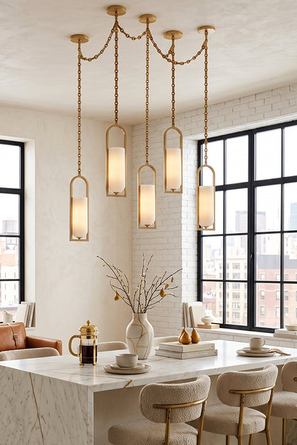 Elegant Cressida Alabaster Melange Chain Chandelier lighting over a modern dining table in a chic interior.