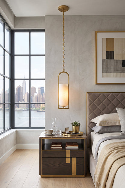 Cressida Alabaster Melange Chain Chandelier hanging above a modern bedside table in an upscale bedroom with city views.